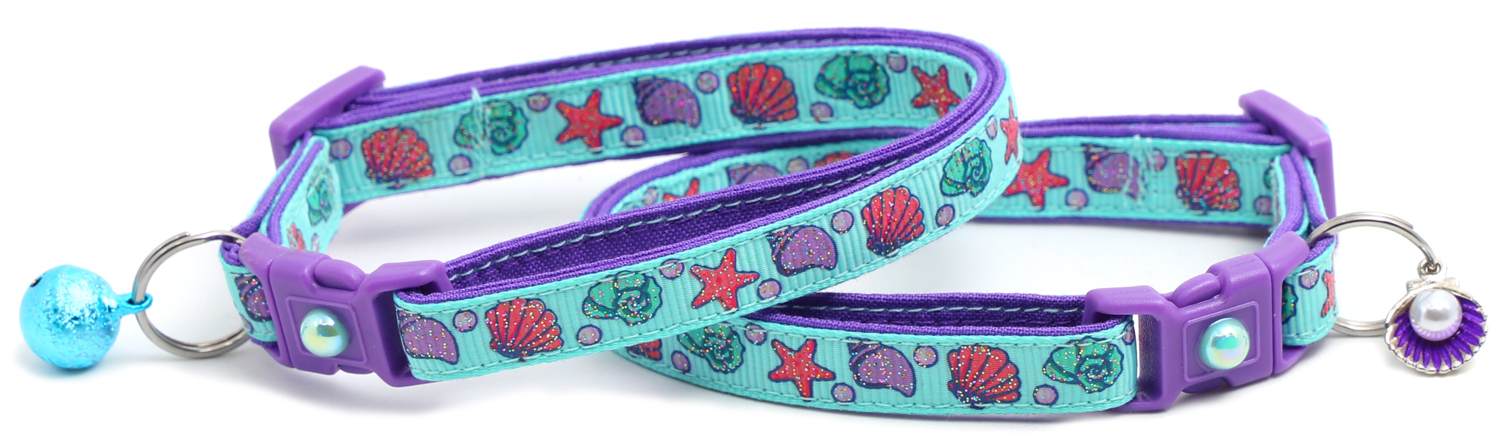 Beachcomber Breakaway Cat Collar in vibrant colors, featuring a breakaway clip and removable bell, made from soft reinforced cotton.